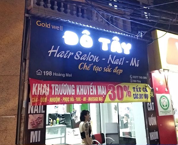 biển quảng cáo tóc và móng